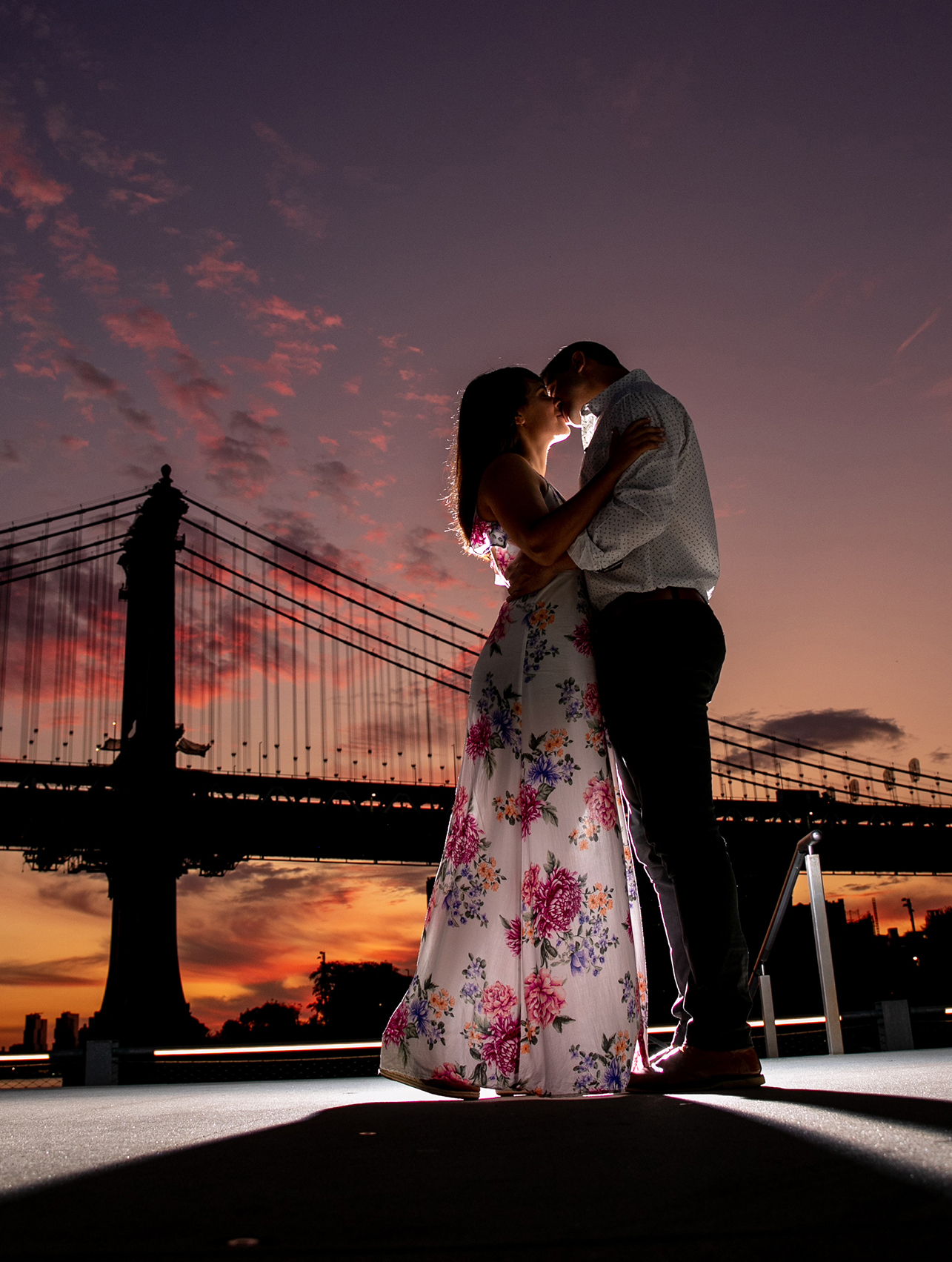 couple kissing at sunrise in new york city