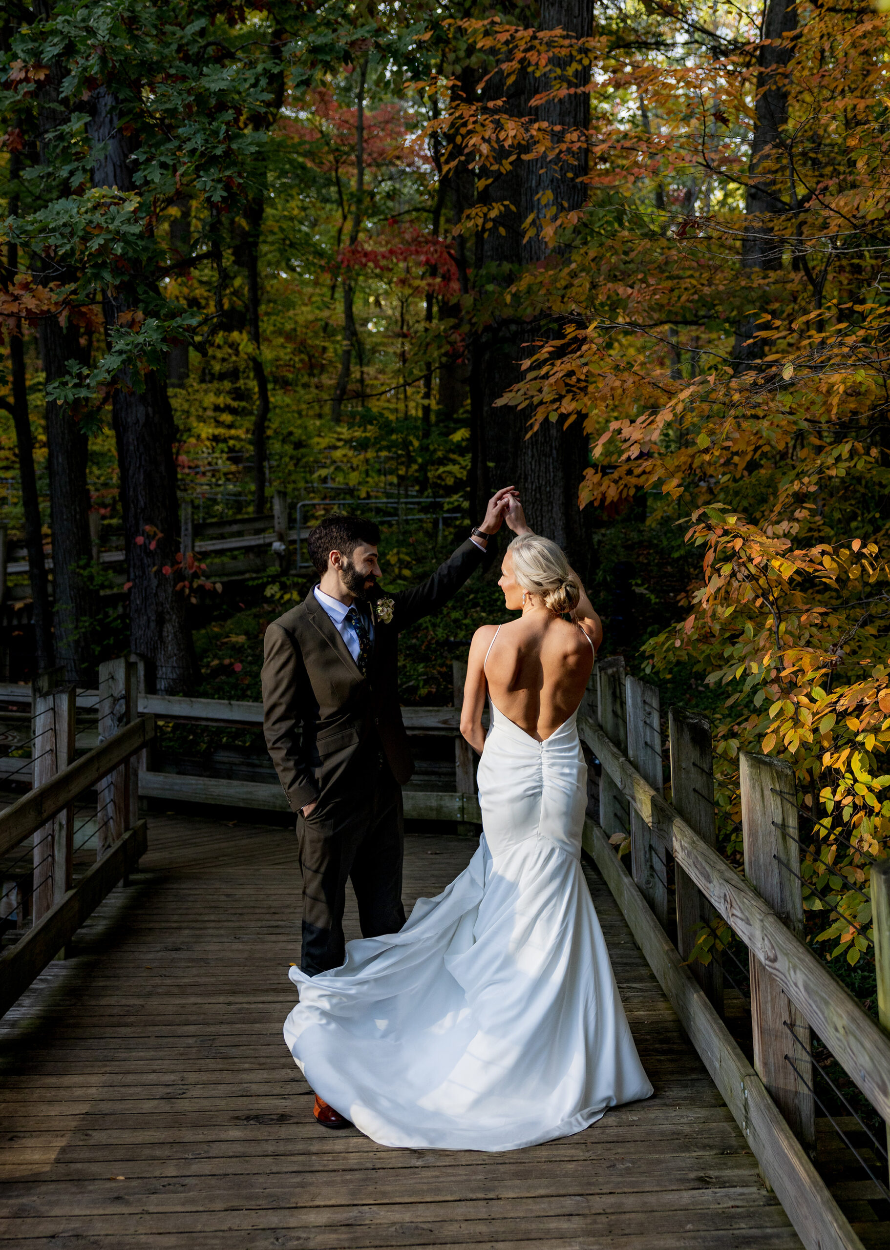 Bride and groom during a fall wedding at John Ball Zoo’s Bissell Tree House in Grand Rapids